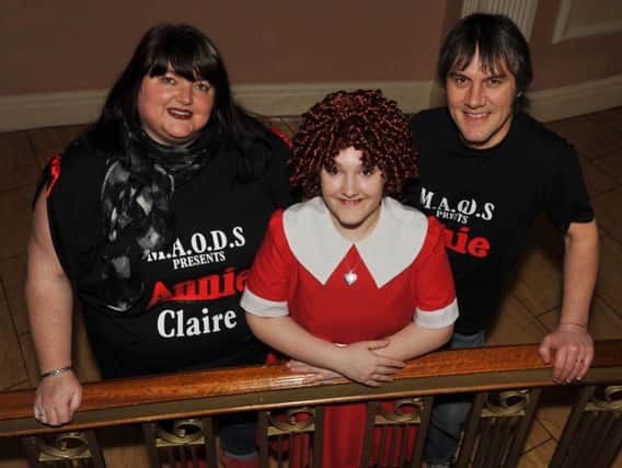 Ella Wragg from Huthwaite is to play Annie at the Palace Theatre in March. Pictured with her mum Claire and dad Ian.