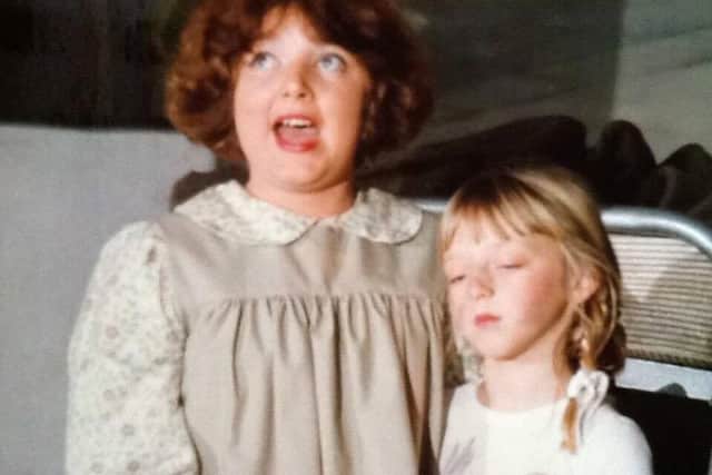 Claire as Annie in 1985, alongside her co-star Lucy, who played Molly.