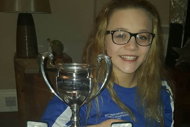 Chloe Quinn, who won an array of medals and cups at the county championships.