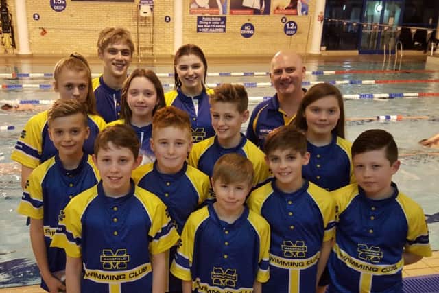 Some of the swimmers from the Mansfield club who qualified for the county championships, with head coach Barry Tindall.