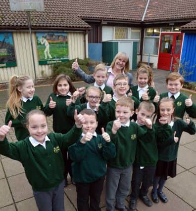 Kirkby Woodhouse primary becomes an Academy school. Headteacher Ruth Maddison with students.