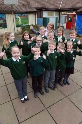 Kirkby Woodhouse primary becomes an Academy school. Headteacher Ruth Maddison with students.
