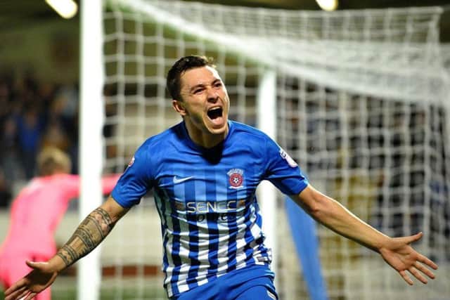 Nathan Thomas celebrates scoring at the Vic.