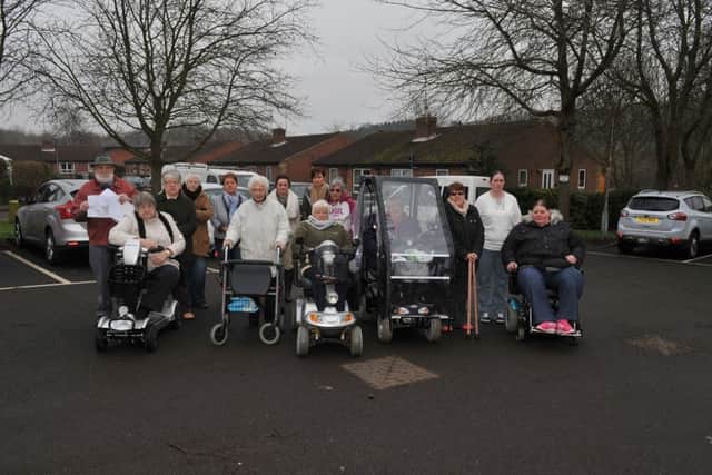 Residents on Eastfield Close, Clipstone are furious at plans to build new houses on their car park, pictured are residents and their family and friends