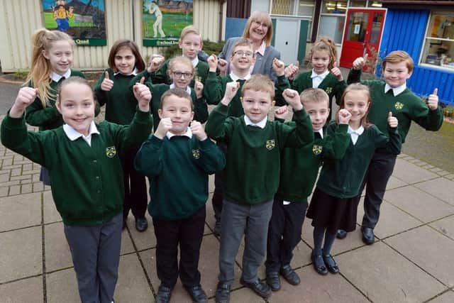 Kirkby Woodhouse primary becomes an Academy school. Headteacher Ruth Maddison with students.