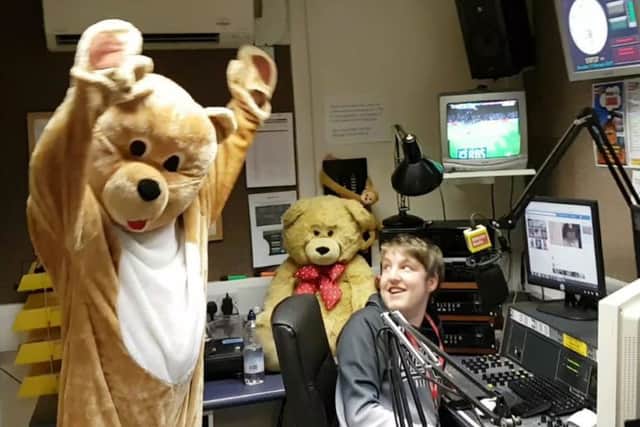 Station mascot, Milly Bear, gets in on the act in presenter Ashley Hardys studio.