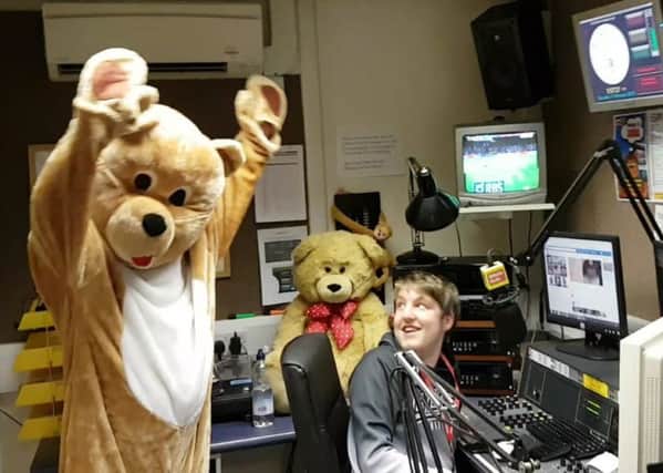 Station mascot, Milly Bear, gets in on the act in presenter Ashley Hardys studio.