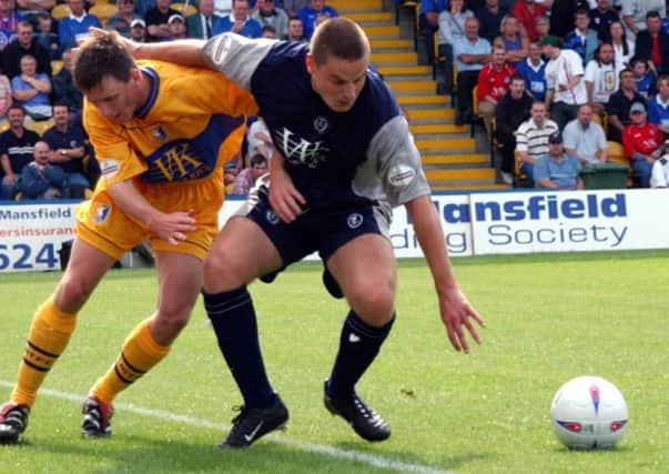 SPORT. 
Mansfield Town V Chesterfield. 
Stags Colin Larkin and Chesterfield's Kevin Dawson clash at Field Mill on Saturday. 
POSTPHOTO C240802TS3-4 PICTURE TONY STOCKS