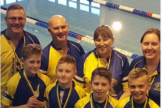 Some of the successful competitors from Mansfield Swimming Club, with their coaches.