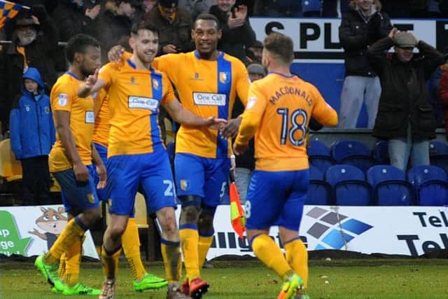Mansfield Town's Ben Whiteman celebrates the Stags' fourth goal with provider Alex MacDonald.