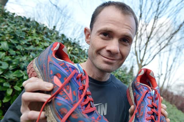 Ben McVay running a marathon for charity.