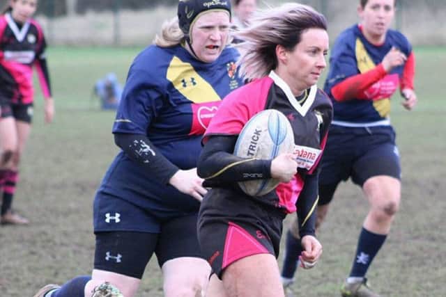 Flanker Vicki Fegan on her way to scoring one of Ashfield Ladies tries in the victory against Five Ways.