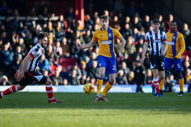Mansfield Town's Ben Whiteman makes the pass - Photo by Chris Holloway