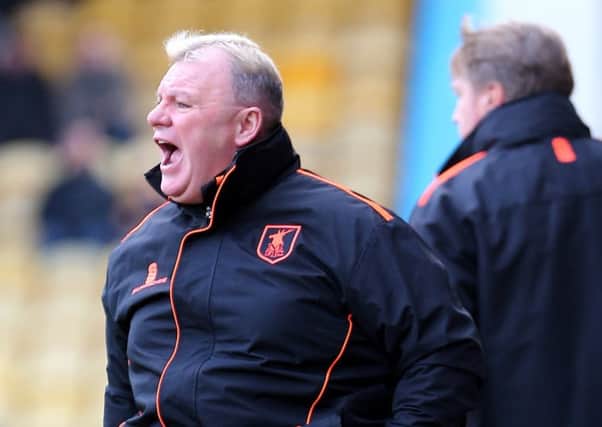 Mansfield Town Manager Steve Evans with assistant Paul Raynor behind
Picture by Dan Westwell