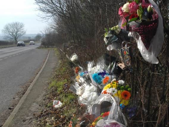 Tributes left to Lewis Crouch at the crash site near Mansfield Woodhouse.