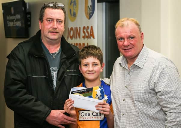 Stags manager Steve Evans, right, with young Brendan Whitehead and his dad, Paul, after they received the season ticket gift. Pics by Chris Holloway - The Bigger Picture