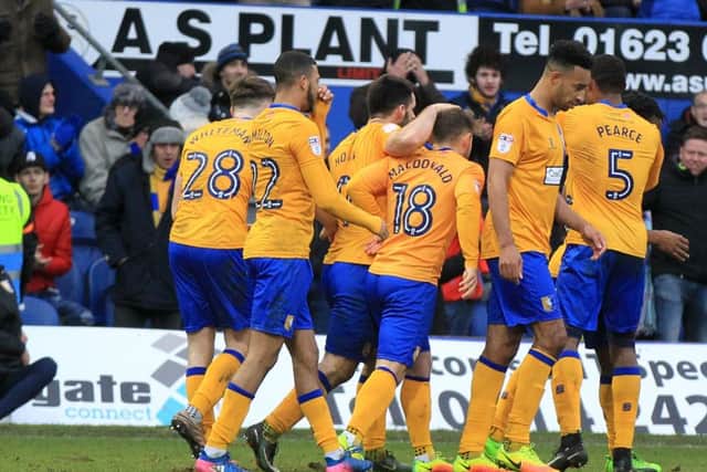 Mansfield Town v Newport County in the Sky Bet League 2. Mansfield player Shaquile Coulthirst scores Mansfield's 2nd goal. Picture: Chris Etchells