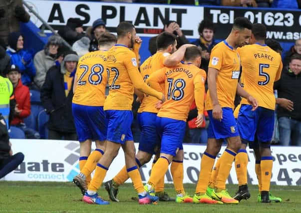 Mansfield Town v Newport County in the Sky Bet League 2. Mansfield player Shaquile Coulthirst scores Mansfield's 2nd goal. Picture: Chris Etchells