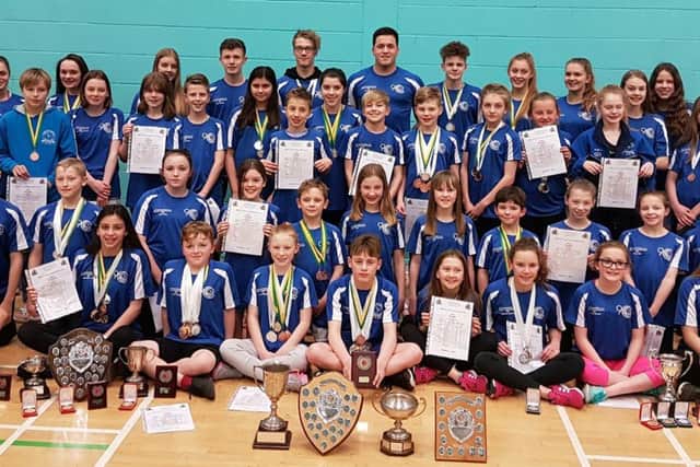 Some of the triumphant Sutton Swimming Club squad that won a hatful of medals at the county championships.
