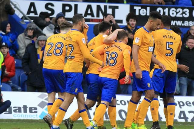 Mansfield Town v Newport County in the Sky Bet League 2. Mansfield player Shaquile Coulthirst scores Mansfield's 2nd goal. Picture: Chris Etchells