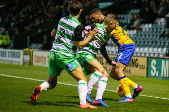 Mansfield Town's CJ Hamilton takes on the Yeovil defence - Photo by Chris Holloway