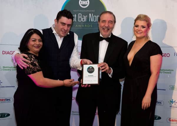 Manager Damien Calko and colleagues Elena Parker (left) and Kirsty Layton receive andwhynots award from police and crime commissioner Paddy Tipping (second right).