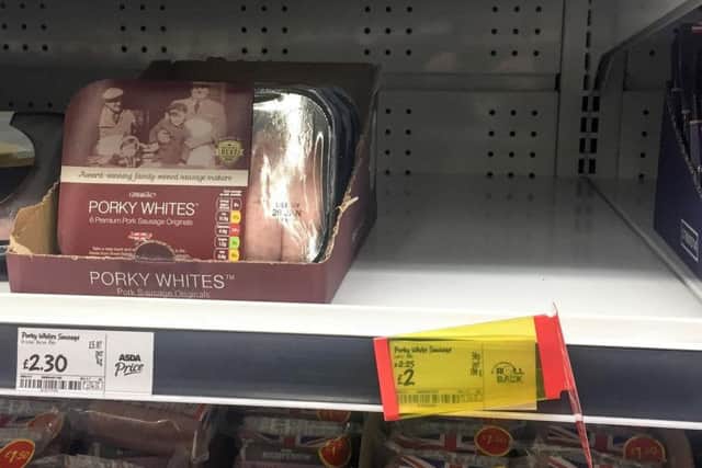 A empty shelf of sold out Porky Lights sausages