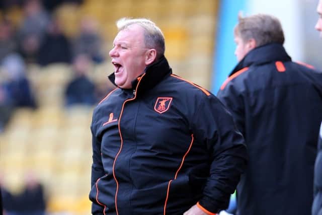 Mansfield Town Manager Steve Evans with assistant Paul Raynor behindPicture by Dan Westwell