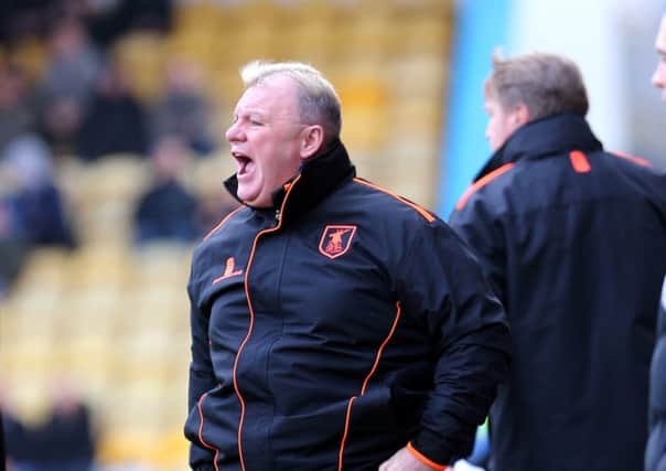 Mansfield Town Manager Steve Evans with assistant Paul Raynor behind
Picture by Dan Westwell