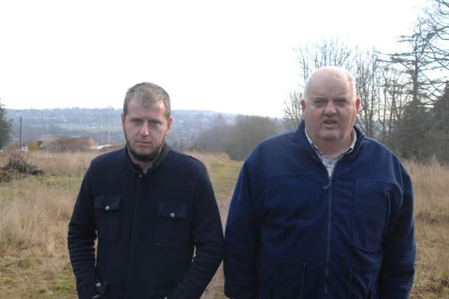 Hopeful travellers' site developers, Aaron Smith (right) and son Benjamin on the plot of land off Churchfield Drive, Rainworth.