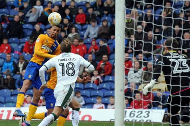 Mansfield Town v Plymouth Argyle.SCJ Hamilton forces  a save from his header