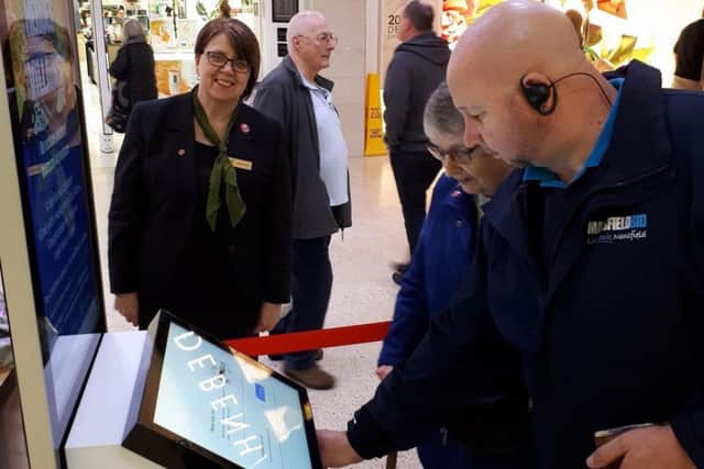 Shoppers and staff at the Four Seasons shopping centre get to grips with new touchpoint stations.