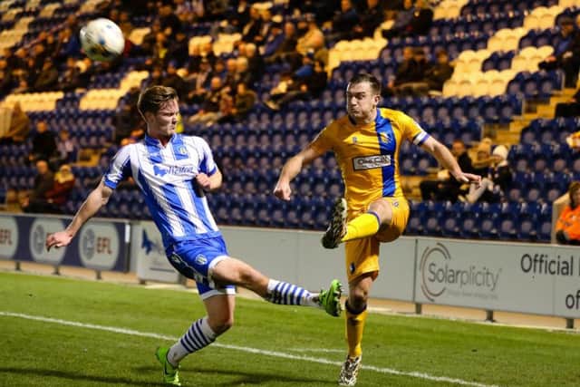 Mansfield Town's Lee Cillins makes the cross - Photo by Chris Holloway
