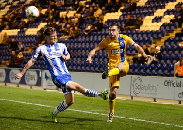 Mansfield Town's Lee Cillins makes the cross - Photo by Chris Holloway