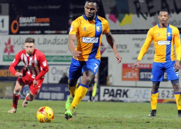 Mansfield v Accrington Stanley.
Shaquile Coulthirst scores the Stags' penalty to level the score at 3 all.