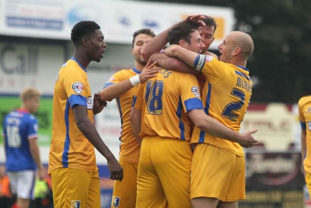 Lee Beevers is congratulated after scoring for Mansfield -Pic by: Richard Parkes