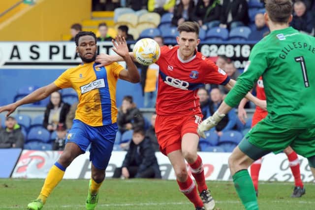 Mansfield Town v Carlisle United.
Shaquile Coulthirst puts pressure on the Carlisle defense.