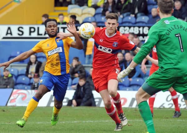 Mansfield Town v Carlisle United.
Shaquile Coulthirst puts pressure on the Carlisle defense.