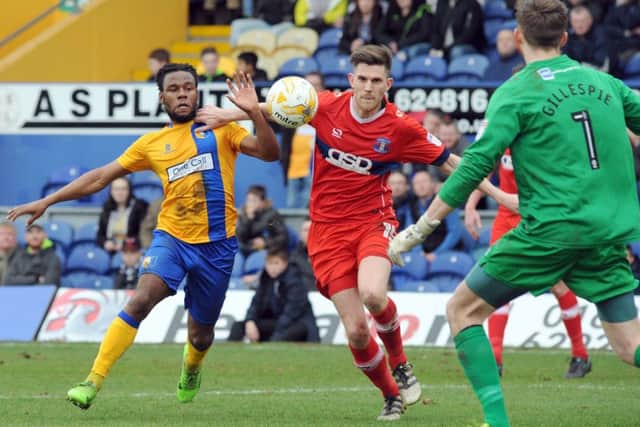 Mansfield Town v Carlisle United.Shaquile Coulthirst puts pressure on the Carlisle defense.