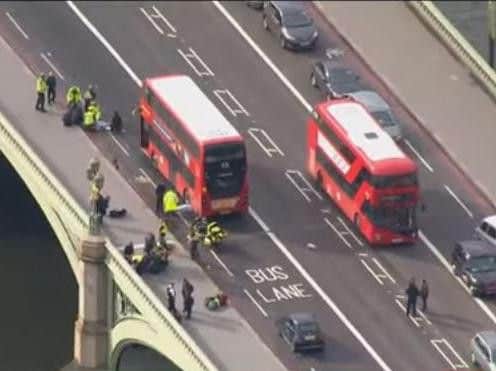 A motorist mounted the curb and ran over pedestrians before charging through the gates of Parliament with two knives, reports say. (image: YouTube)