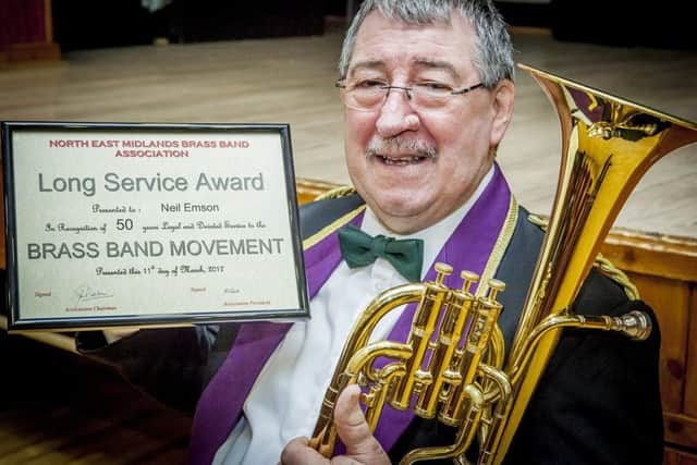 Shirebrook Unison Brass Band member Neil Emson gets an award for 50 years in brass banding. He has played for various bands since 1967 including Gainsborough and the famous Grimesthorpe band.