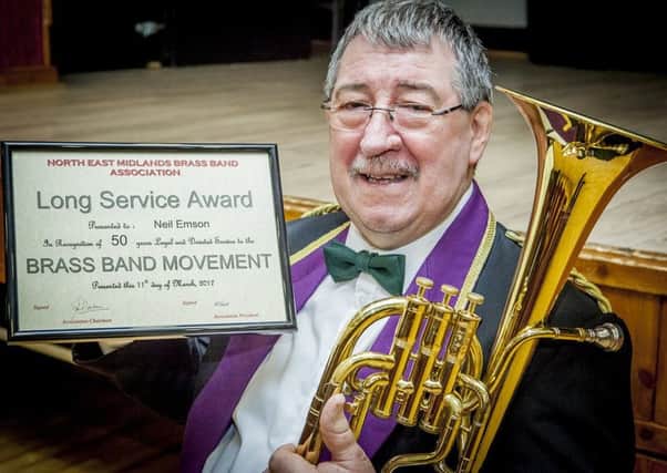 Shirebrook Unison Brass Band member Neil Emson gets an award for 50 years in brass banding. He has played for various bands since 1967 including Gainsborough and the famous Grimesthorpe band.