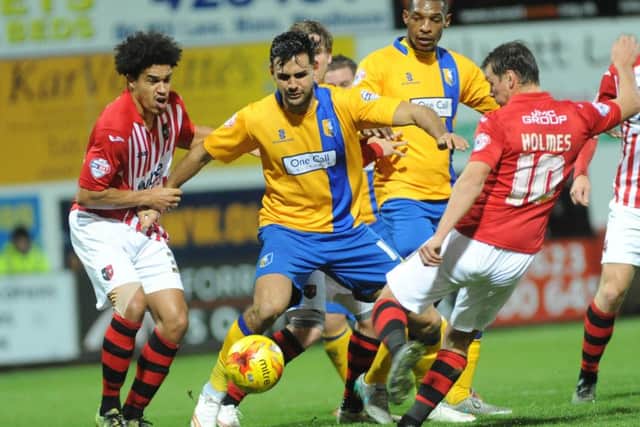 Mansfield Town v Exeter City - Skybet League Two - One Call Stadium - Tuesday 24th November 2015Ryan Tafazolli battles with Lee Holmes and Troy Brown