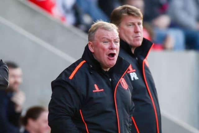 Mansfield Town's Manager Steve Evans and his assistant Paul Raynor - Photo by Chris Holloway