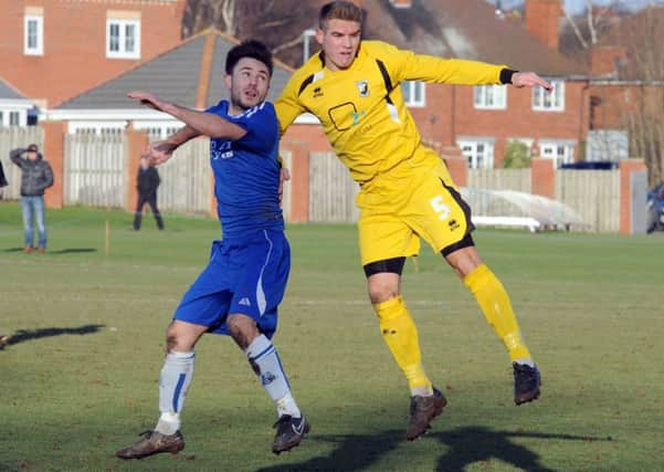 Matchwinner Lewis Bingham (left), who scored the only goal of the game to ensure Ollerton Towns safety.