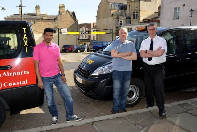 Taxi drivers hit with six point fines are to challenge Mansfield District Council, pictured are from left taxi rank rep, Nazrul Miah, Malcolm Spalding and Christopher Riley
