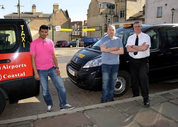 Taxi drivers hit with six point fines are to challenge Mansfield District Council, pictured are from left taxi rank rep, Nazrul Miah, Malcolm Spalding and Christopher Riley
