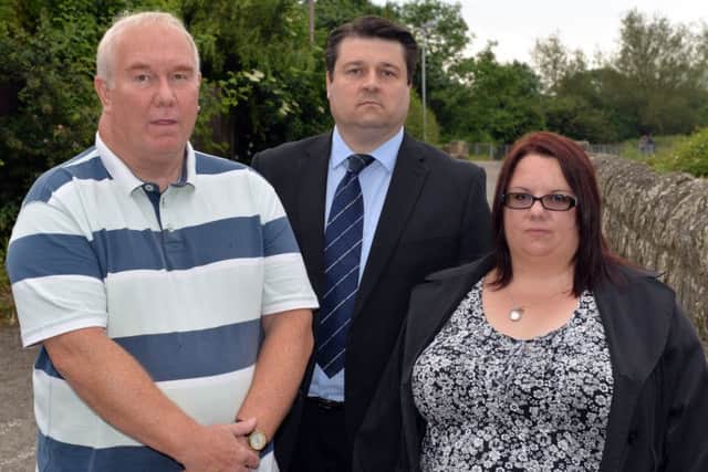 The family of Phil Dawn and councillors are campagining for a bridge over the level crossing near Kings Mill reservoir. Pictured are John Dawn, Coun Darren Langton and Phil's sister Tracy Hart
