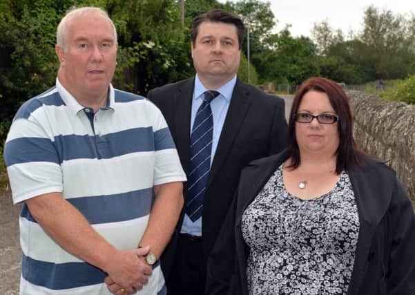 The family of Phil Dawn and councillors are campagining for a bridge over the level crossing near Kings Mill reservoir. Pictured are John Dawn, Coun Darren Langton and Phil's sister Tracy Hart