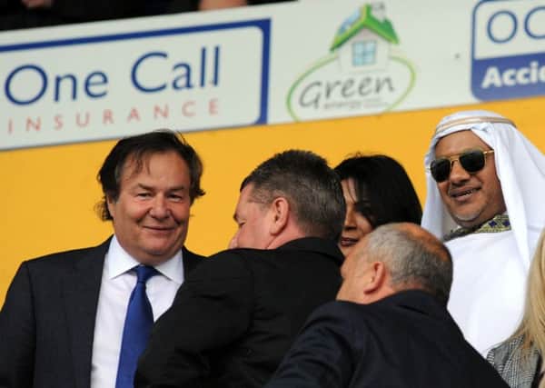 Stags owner John Radford with 
Mr Mansour Cin Hamad Al Stagni, putting a smile on the face of Mansfield Town last weekend.